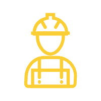 Construction worker wearing safety gear at a building site.